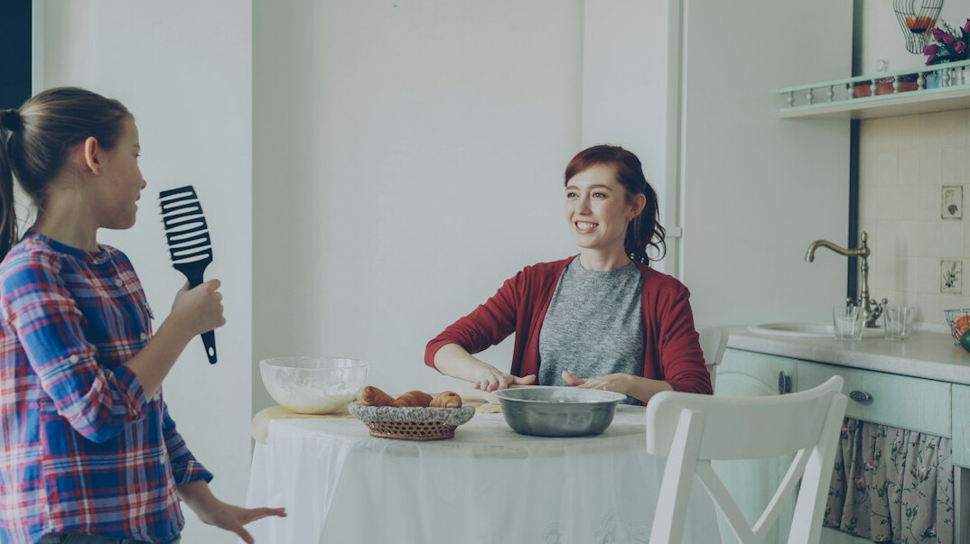 Woman mentoring another person at a table