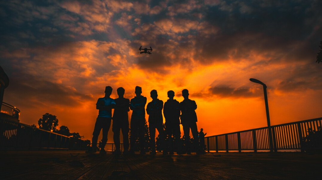 Group of six professionals of different ages smiling together